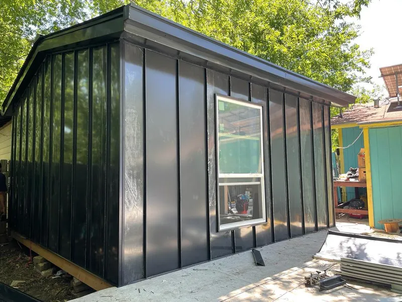 Black standing seam metal wall panels for Roof Inspection in Rosenberg