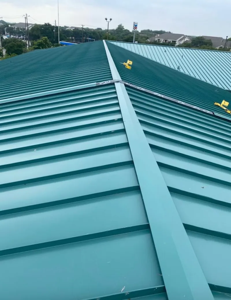 Green commercial metal roof ridge and valley for Metal Roof Repair in Rosenberg